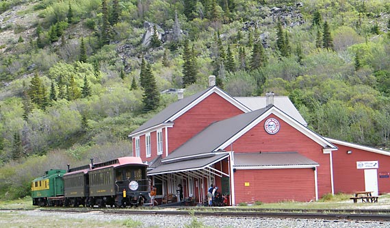 Hikers getting ready to board the train at historic Bennett Station